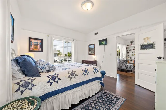 a bed room with bed and window