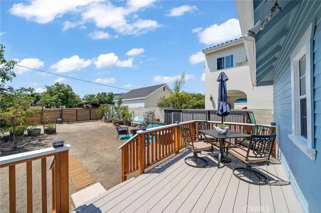 a view of balcony with deck and outdoor seating
