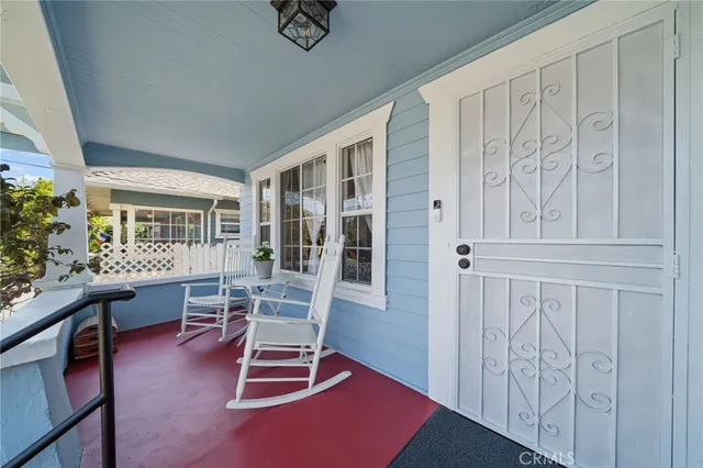 a view of a livingroom with furniture and hardwood floor