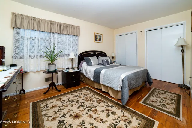 a bedroom with bed and a window