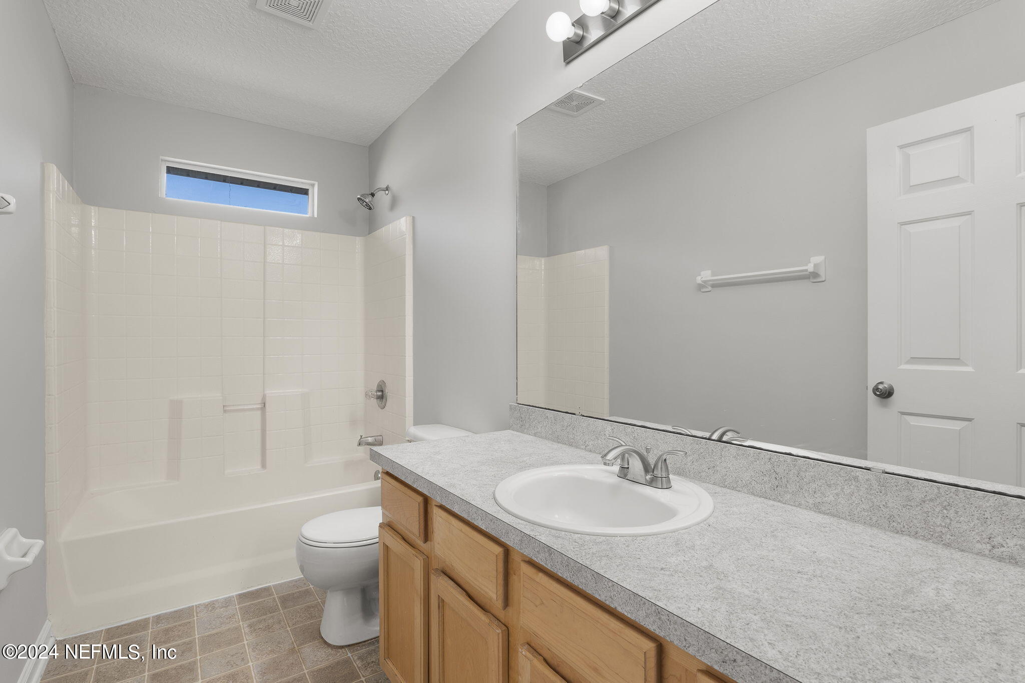 1579 Timber Trace Drive St. Augustine, FL 32092 - Photo 11 of 30 a bathroom with a granite countertop sink toilet and shower