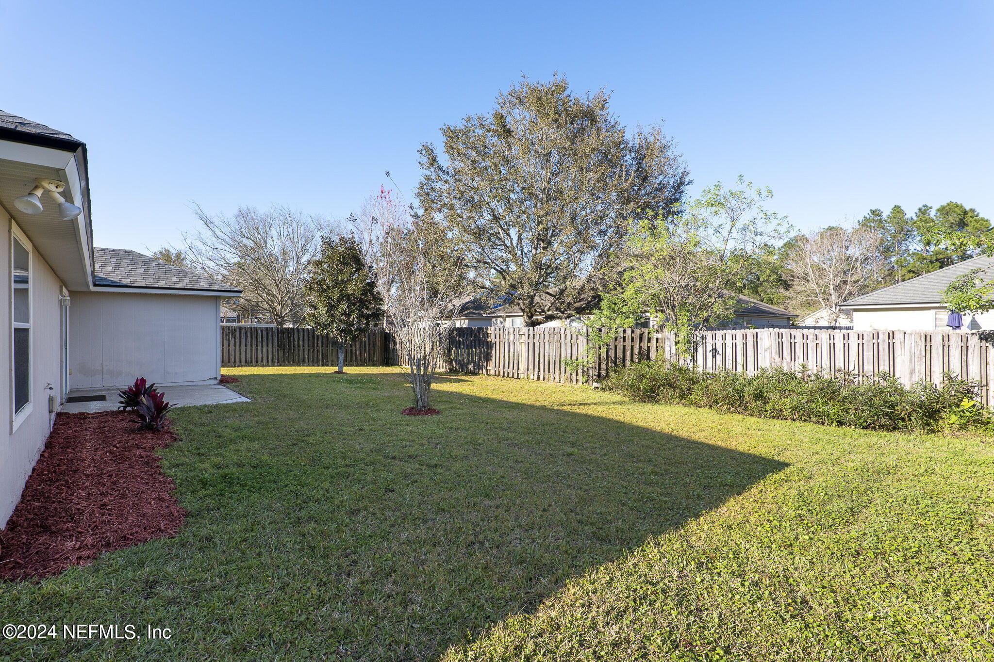 1579 Timber Trace Drive St. Augustine, FL 32092 - Photo 12 of 30 a view of a house with backyard and trees