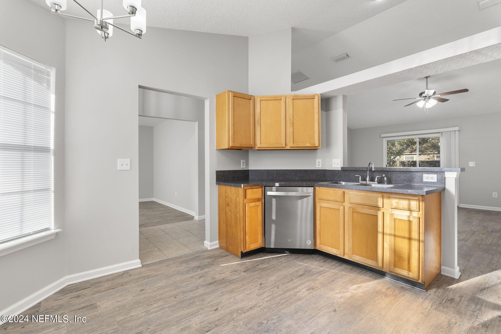 1579 Timber Trace Drive St. Augustine, FL 32092 - Photo 15 of 30 a kitchen with granite countertop a sink cabinets and window