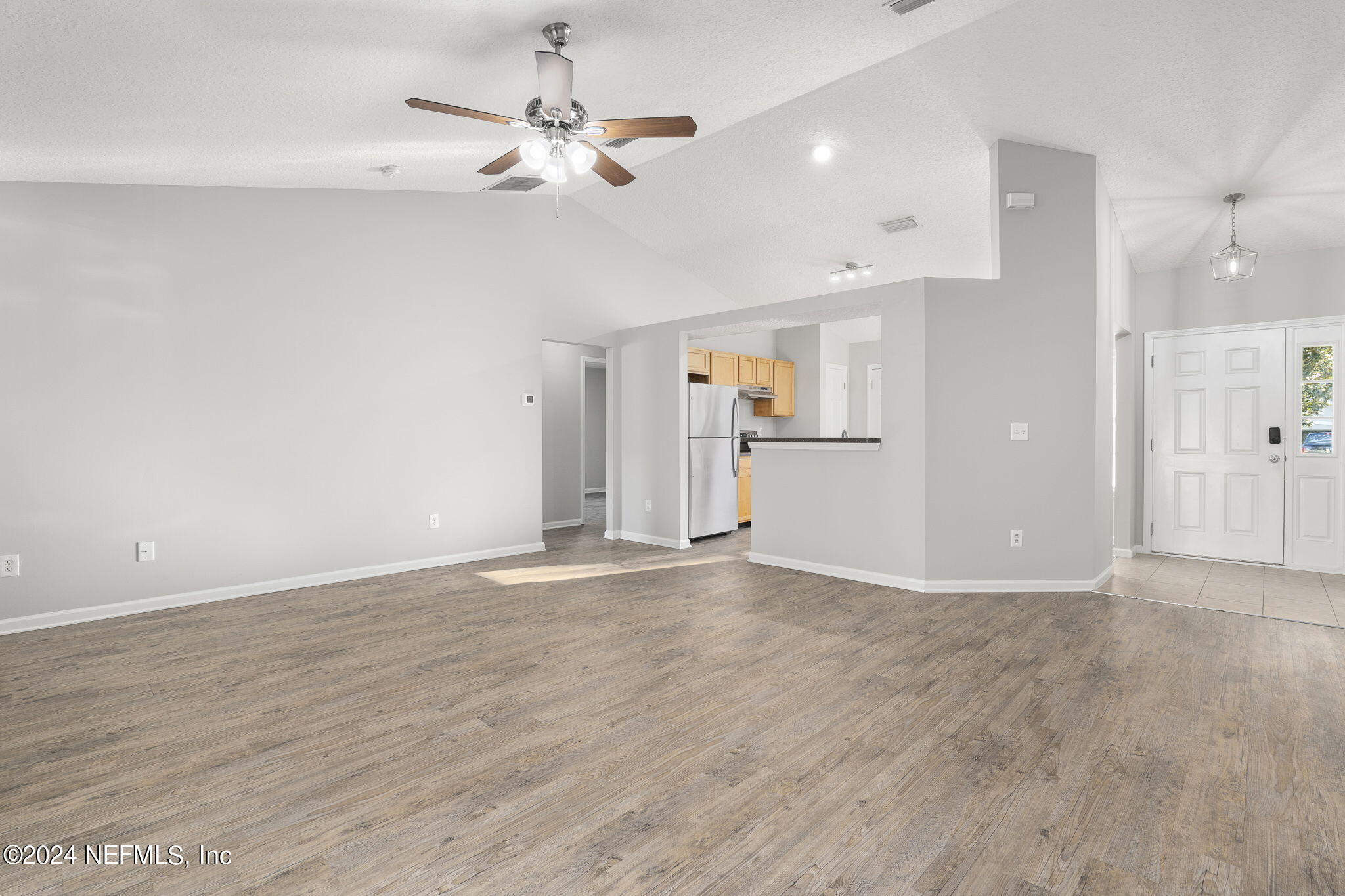 1579 Timber Trace Drive St. Augustine, FL 32092 - Photo 17 of 30 a view of an empty room with a kitchen