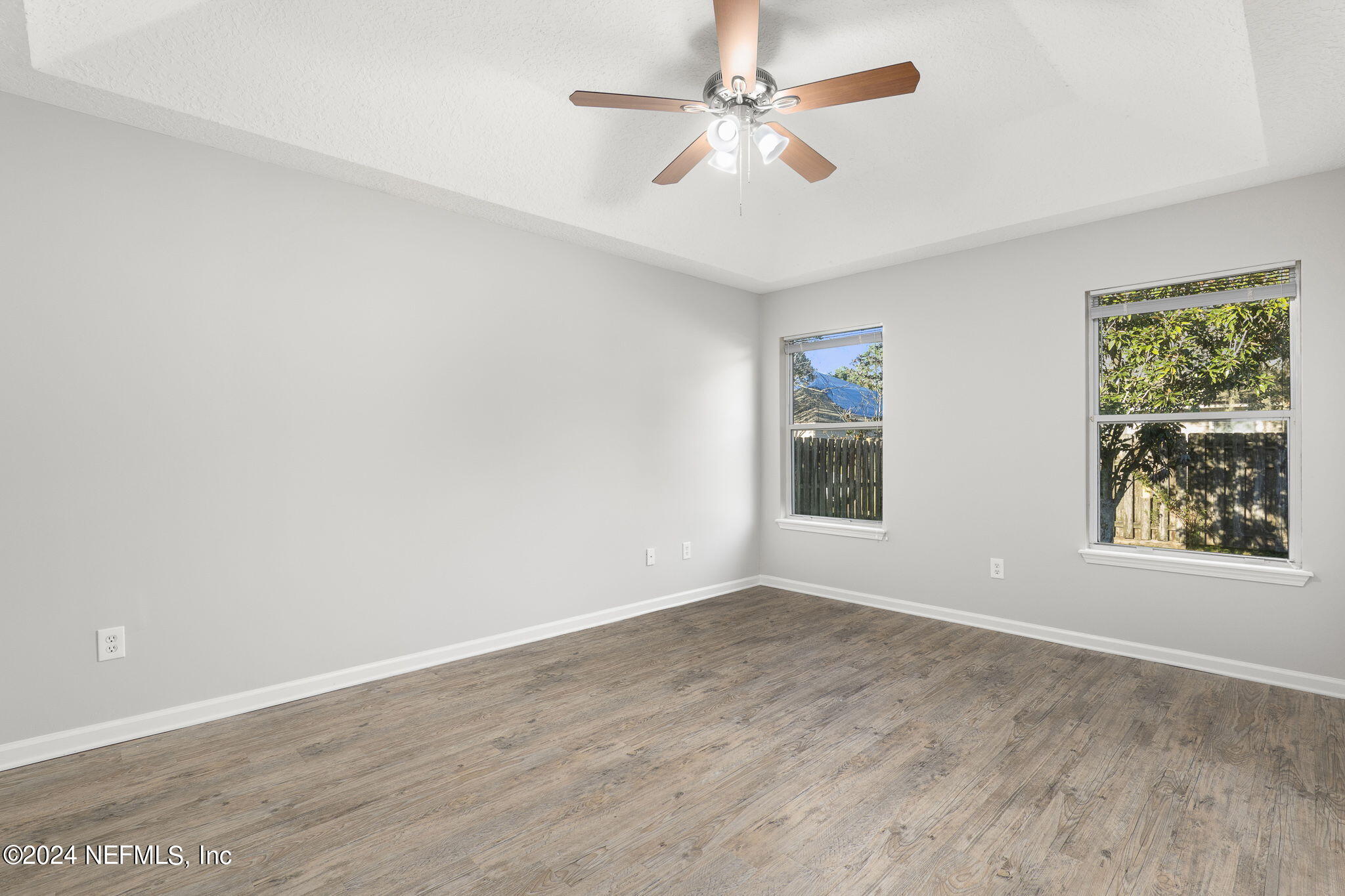 1579 Timber Trace Drive St. Augustine, FL 32092 - Photo 22 of 30 wooden floor in an empty room with a window