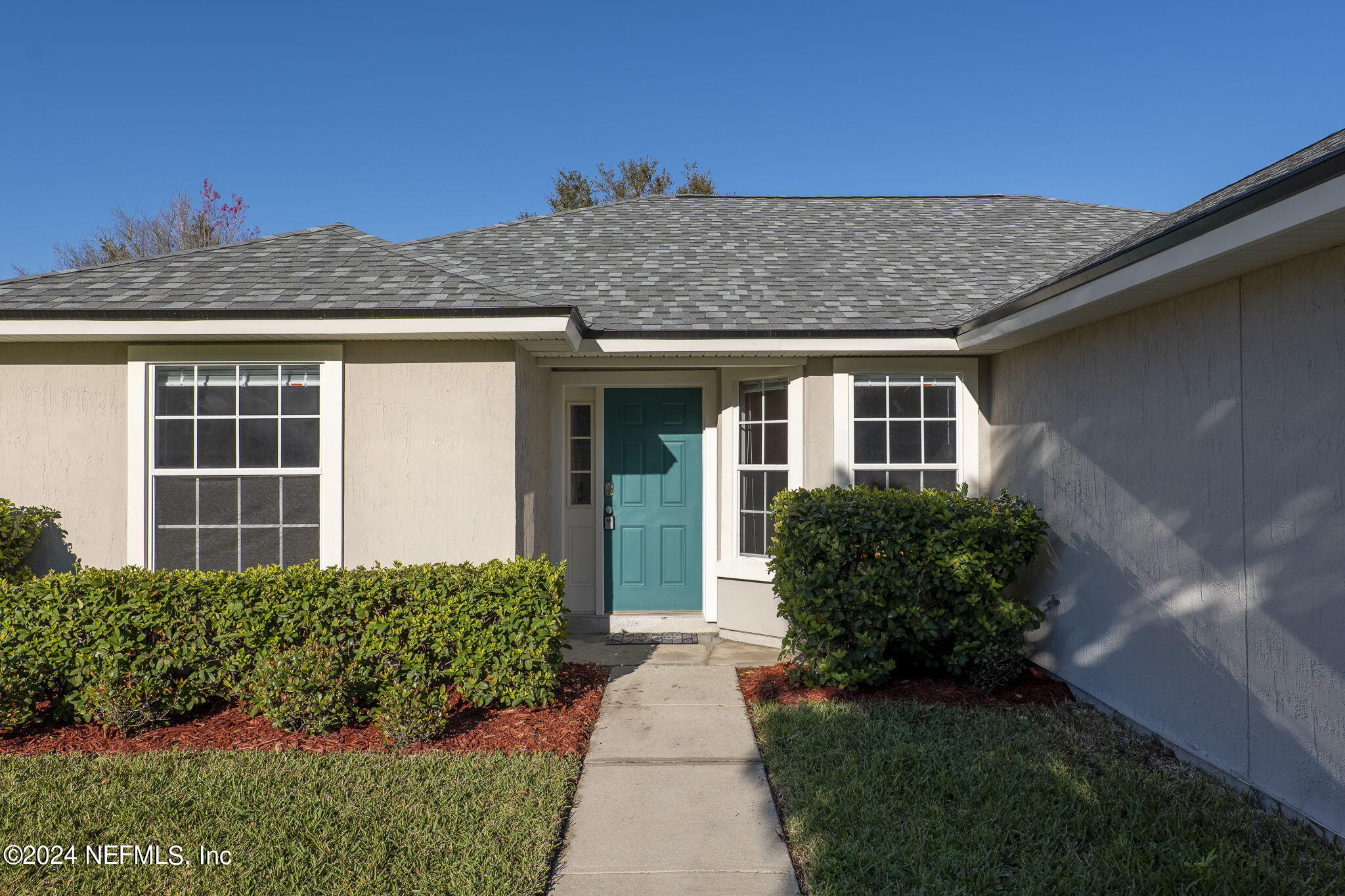 1579 Timber Trace Drive St. Augustine, FL 32092 - Photo 24 of 30 a front view of a house with a yard