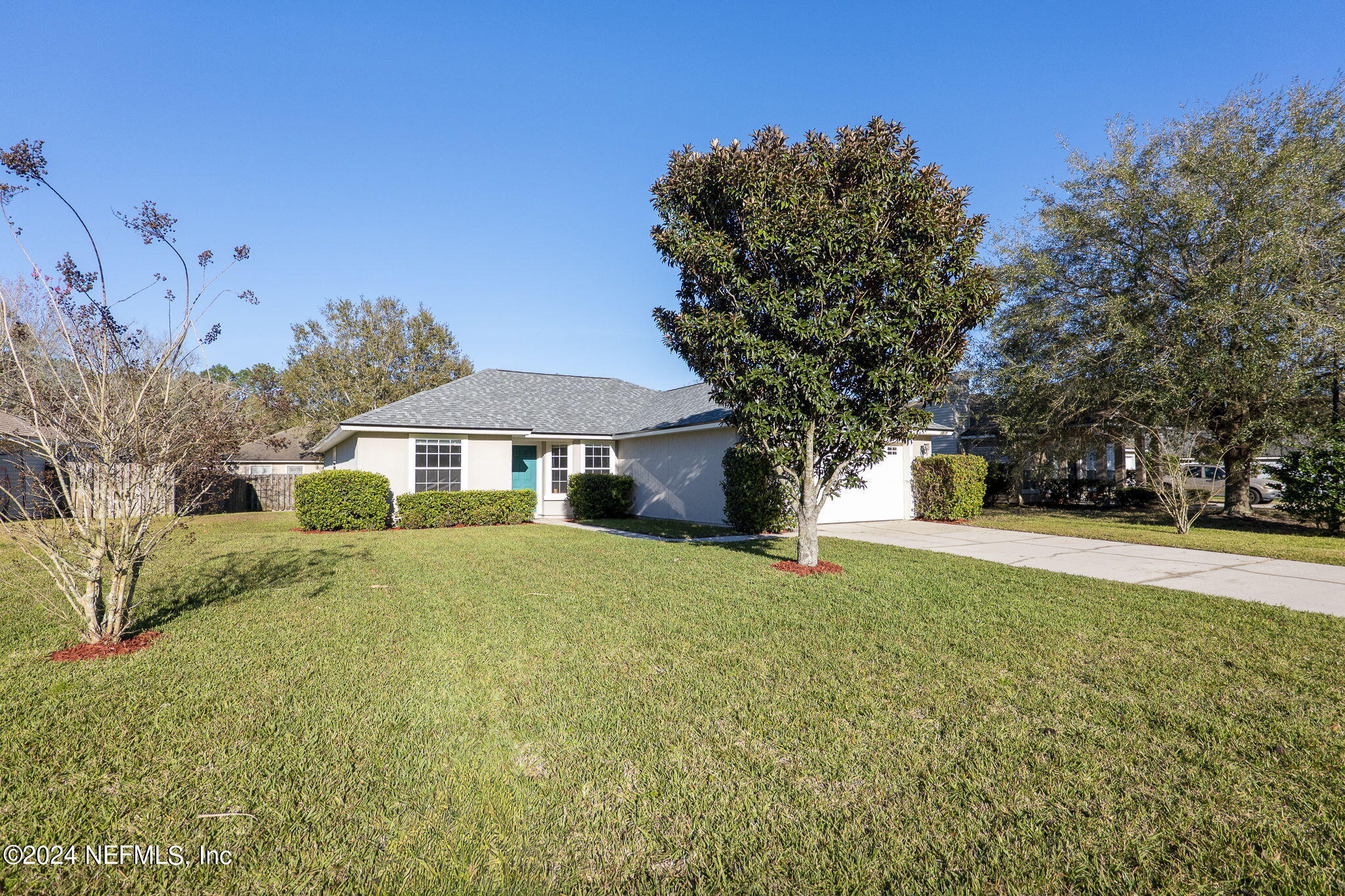 1579 Timber Trace Drive St. Augustine, FL 32092 - Photo 25 of 30 a front view of a house with a yard