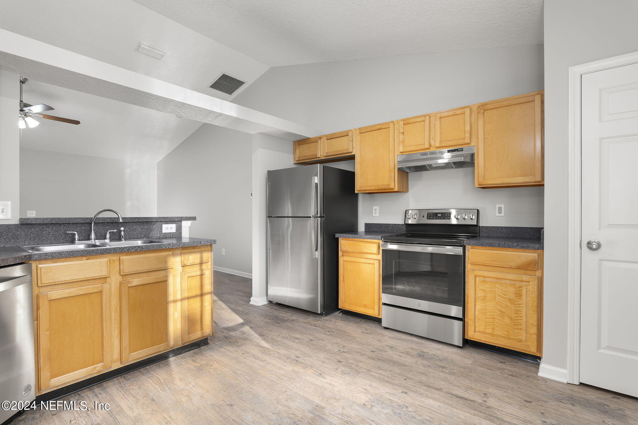 1579 Timber Trace Drive St. Augustine, FL 32092 - Photo 3 of 30 a kitchen with a refrigerator and a sink