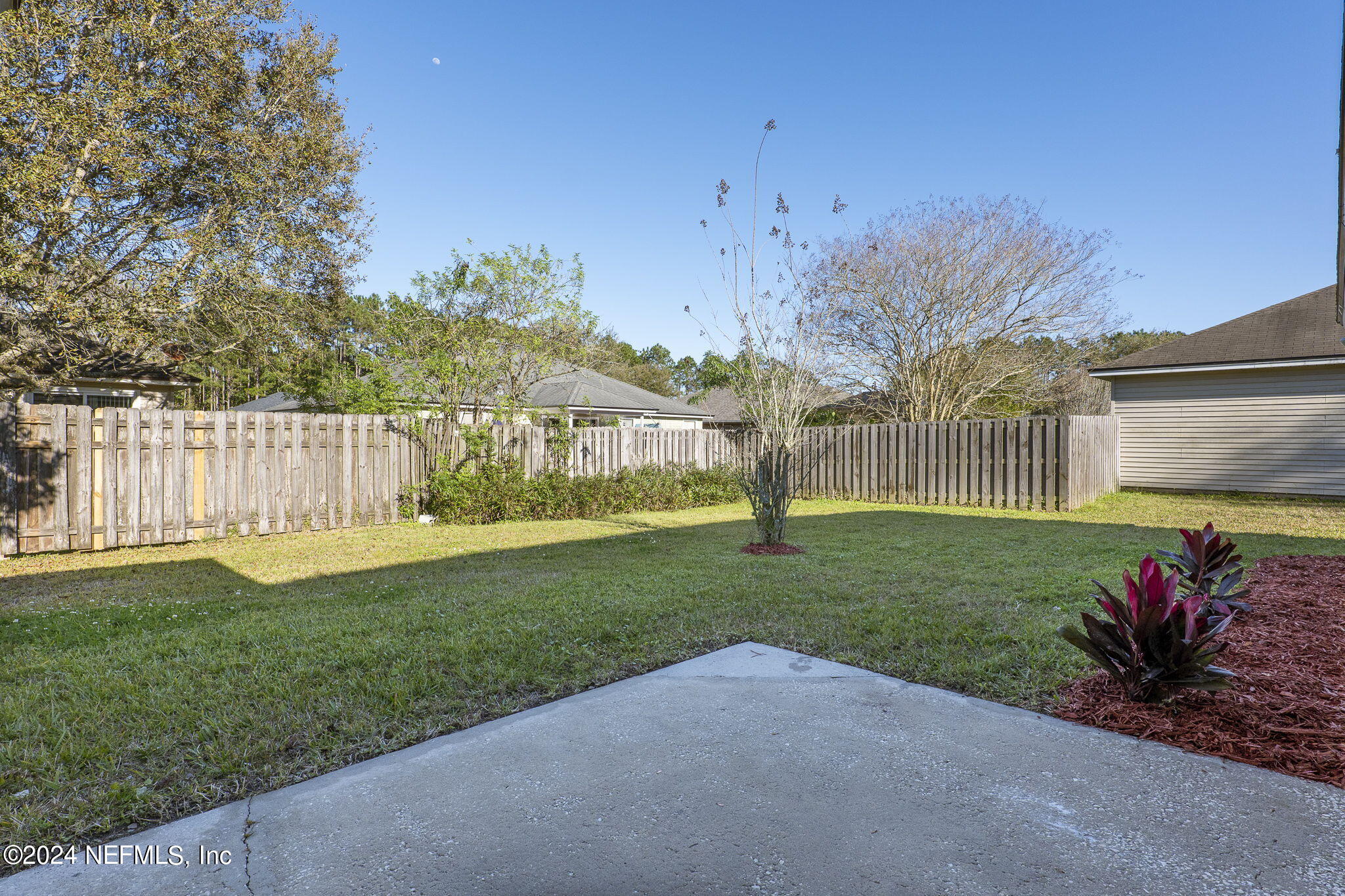 1579 Timber Trace Drive St. Augustine, FL 32092 - Photo 5 of 30 a view of a park with a large trees with wooden fence