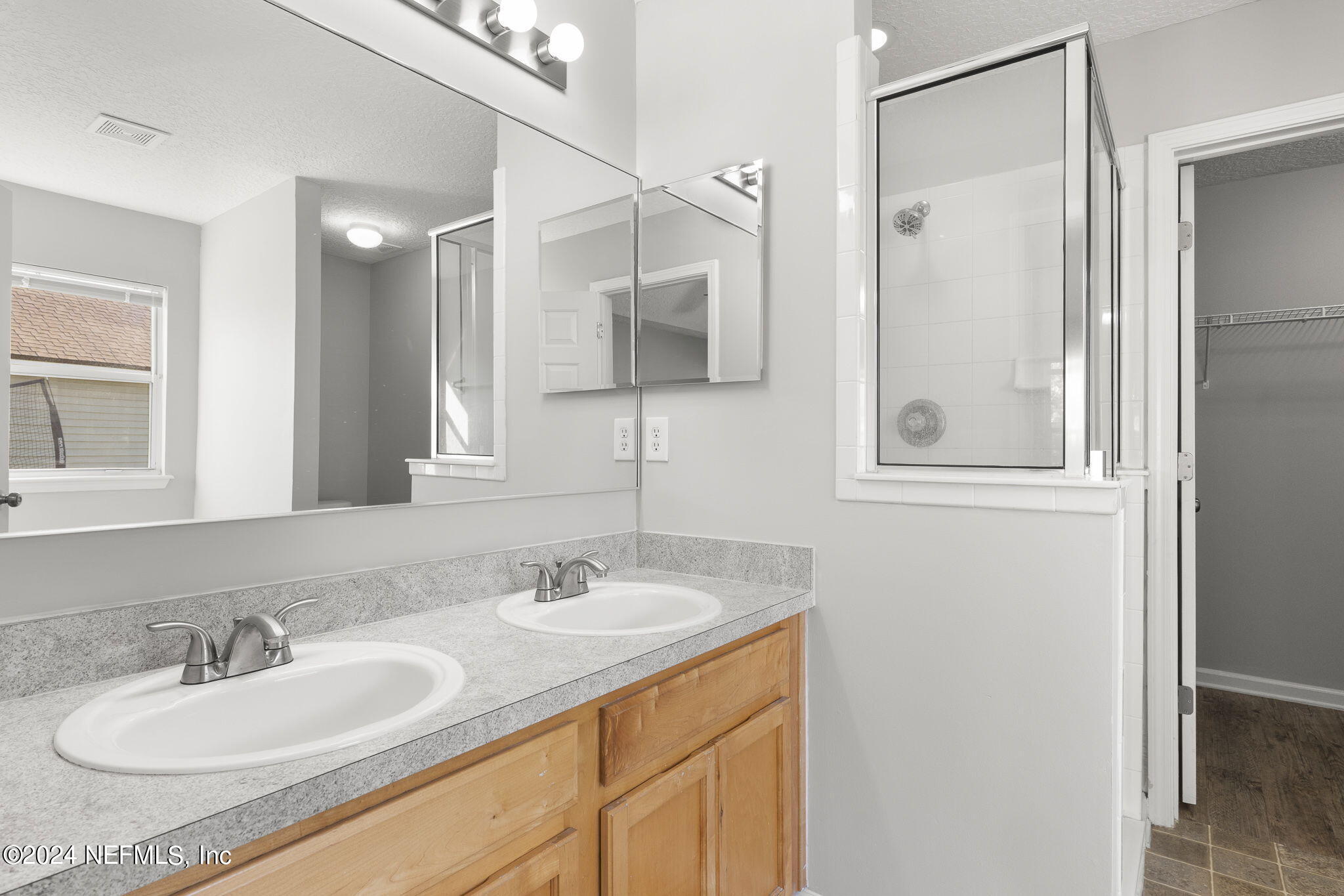 1579 Timber Trace Drive St. Augustine, FL 32092 - Photo 7 of 30 a bathroom with a sink double vanity and a mirror