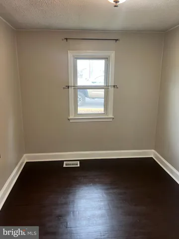 a kitchen with a stove a sink and a refrigerator