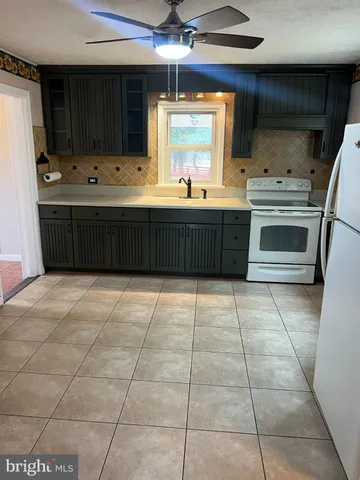 a bathroom with a sink a mirror and a bathtub