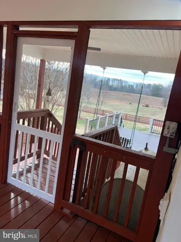 a view of a balcony with wooden floor