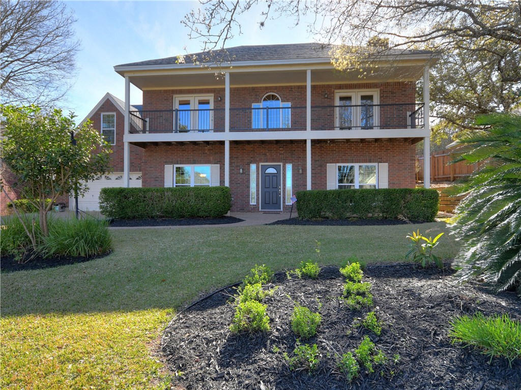 9309 Creeks Edge Circle Austin, TX 78733 - Photo 1 of 1 a front view of a house with a yard