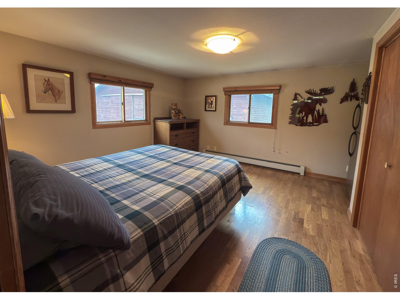 14884 Rist Canyon Road Bellvue, CO 80512 - Photo 14 of 50 a bedroom with a bed and a window