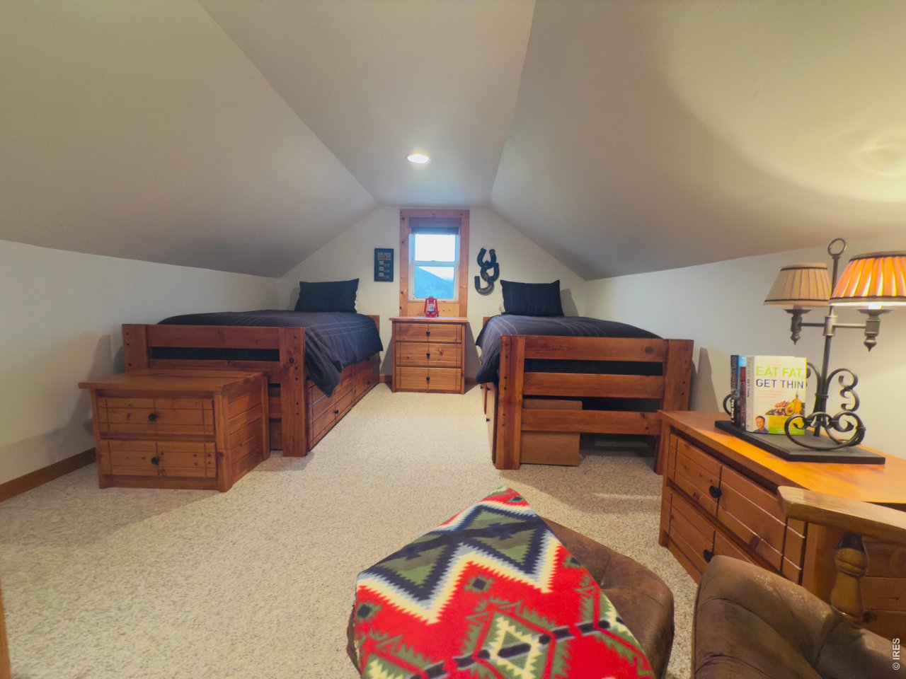 14884 Rist Canyon Road Bellvue, CO 80512 - Photo 18 of 50 a bedroom with furniture and a dresser