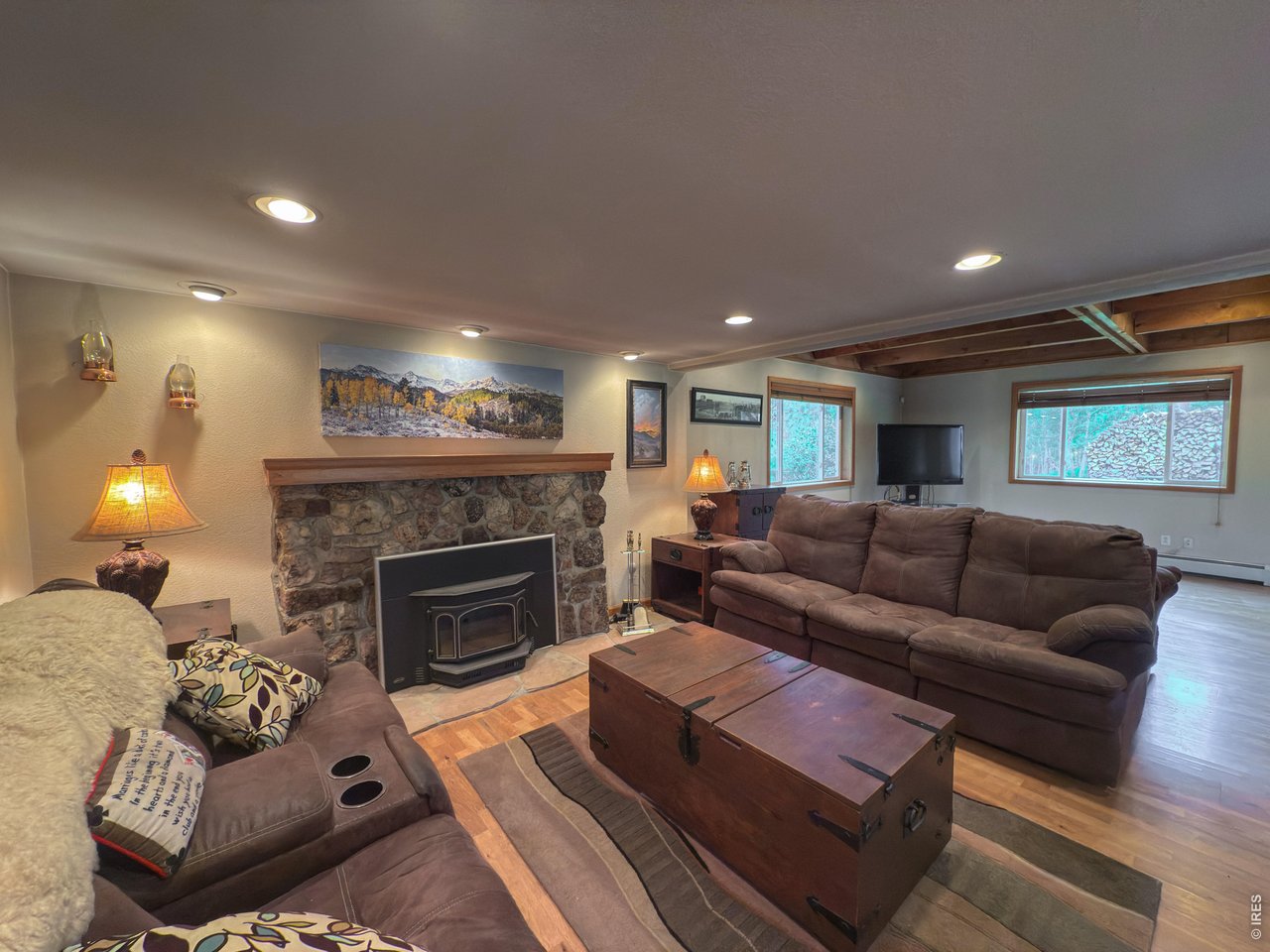 14884 Rist Canyon Road Bellvue, CO 80512 - Photo 9 of 50 a living room with furniture and a fireplace