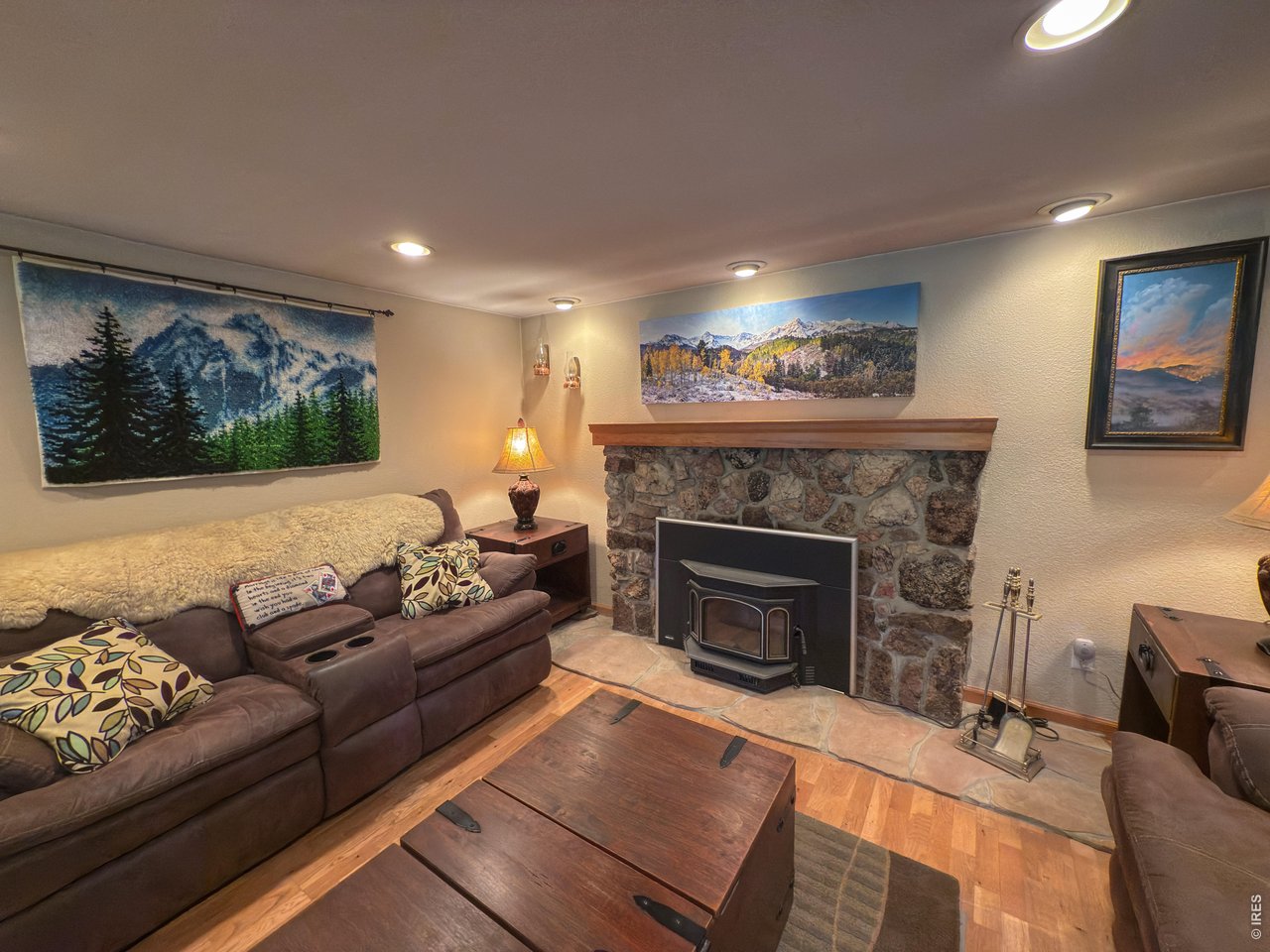 14884 Rist Canyon Road Bellvue, CO 80512 - Photo 10 of 50 a living room with furniture and a fireplace