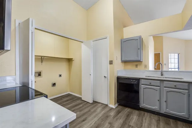 a spacious bathroom with a sink and a mirror