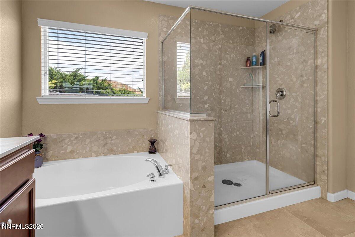 104 Bethpage Road Dayton, NV 89403 - Photo 28 of 65 a bathroom with a bathtub and a shower