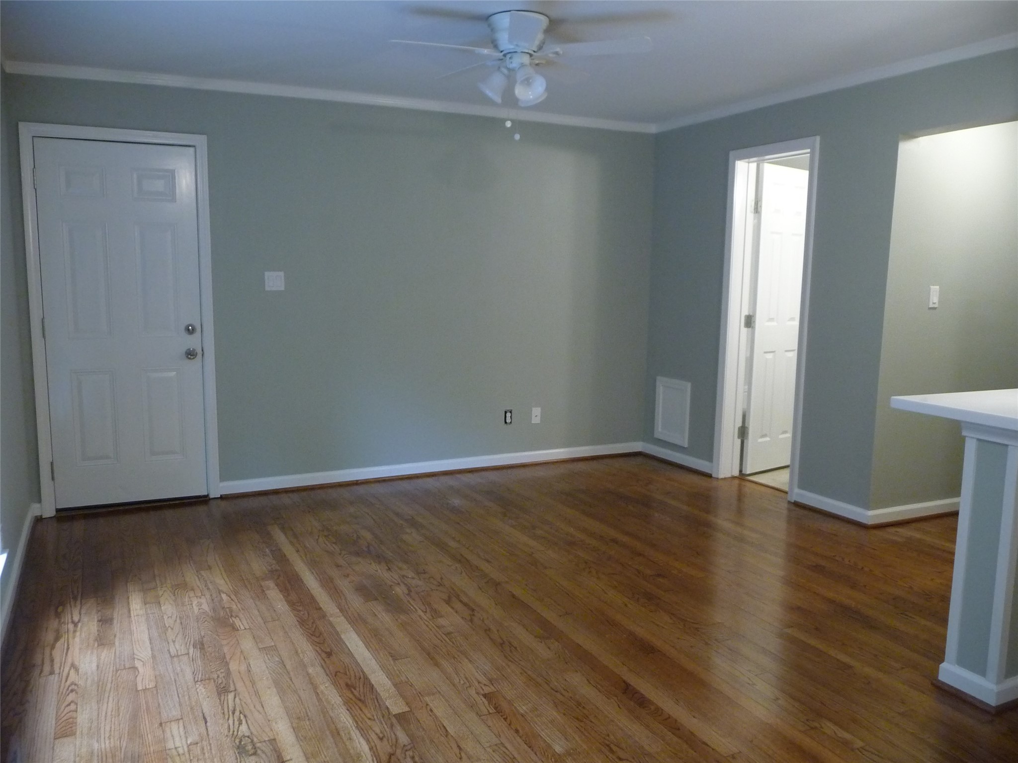 1909 Fairview Street, Unit 2 Houston, TX 77019 - Photo 8 of 10 an empty room with wooden floor and windows