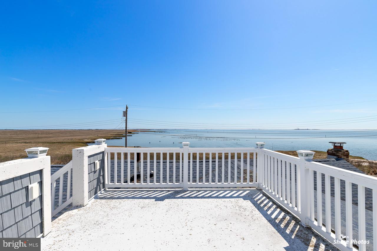 10 Iowa Court Tuckerton, NJ 08087 - Photo 13 of 33 a view of a roof deck with wooden floor and fence