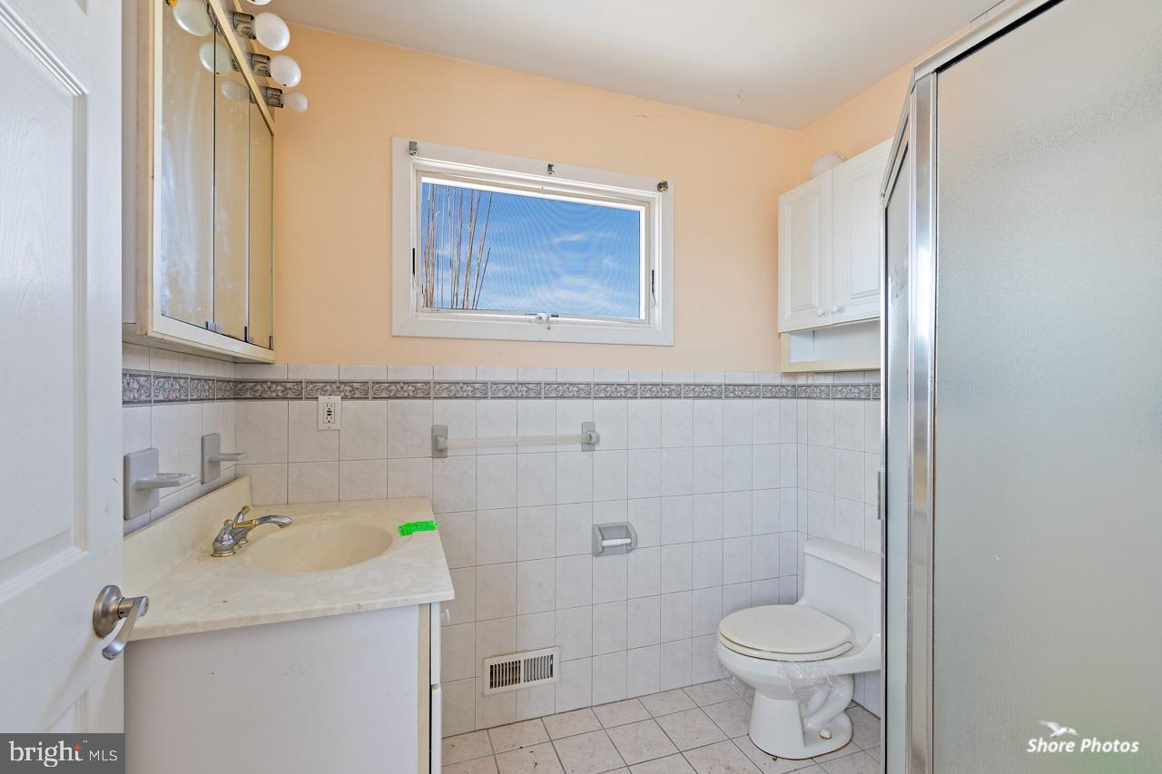 10 Iowa Court Tuckerton, NJ 08087 - Photo 26 of 33 a bathroom with a sink toilet and shower