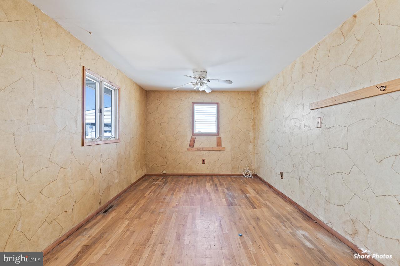 10 Iowa Court Tuckerton, NJ 08087 - Photo 29 of 33 a view of an empty room with wooden floor and a window