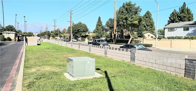 a swimming pool with outdoor seating and yard