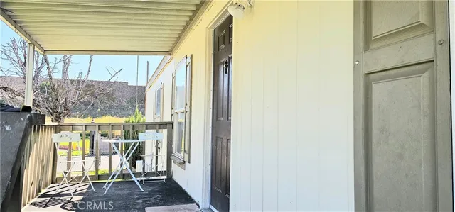 a view of entryway with wooden floor and a potted plant