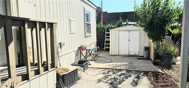 a view of two chairs in the patio