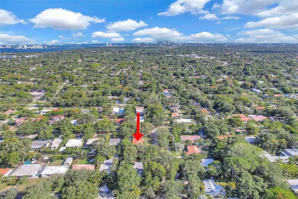 a view of city and green space