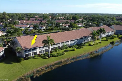 an aerial view of a house with garden space and street view