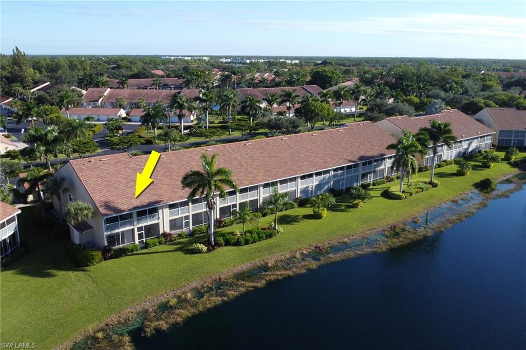 2386 Magnolia Avenue, Unit 7816 Naples, FL 34112 - Photo 20 of 28 an aerial view of a house with garden space and street view