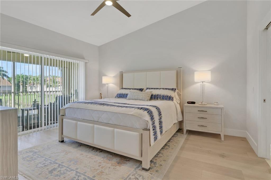 2386 Magnolia Avenue, Unit 7816 Naples, FL 34112 - Photo 8 of 28 a bed room with a bed and a night stand