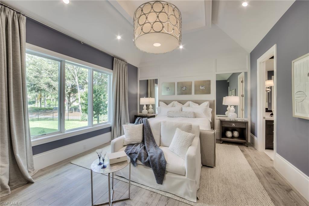 13981 Williston Way Naples, FL 34119 - Photo 12 of 13 a living room with furniture and a large window