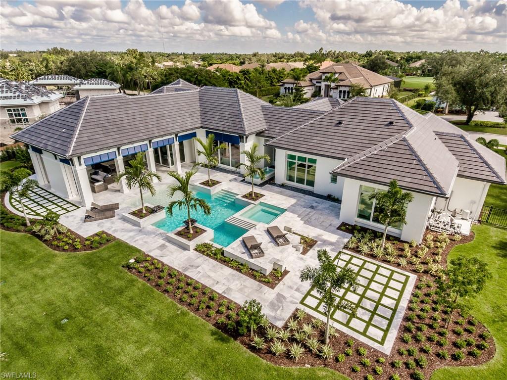 13981 Williston Way Naples, FL 34119 - Photo 2 of 13 an aerial view of a house with a garden