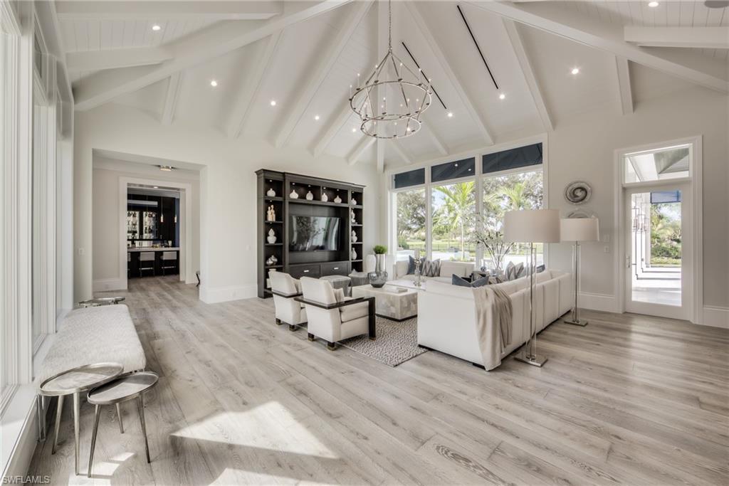 13981 Williston Way Naples, FL 34119 - Photo 4 of 13 a living room with furniture and a large window