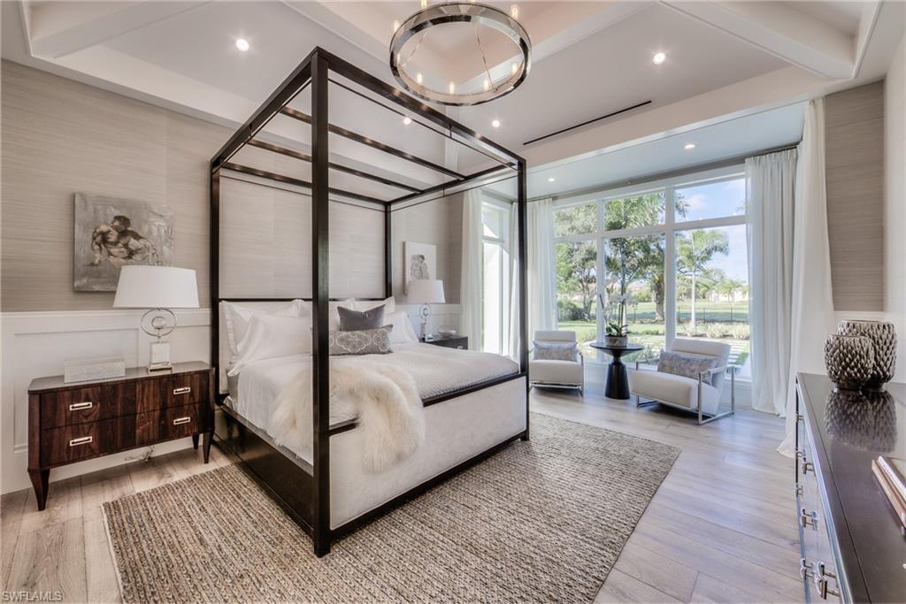 13981 Williston Way Naples, FL 34119 - Photo 8 of 13 a living room with furniture and a chandelier