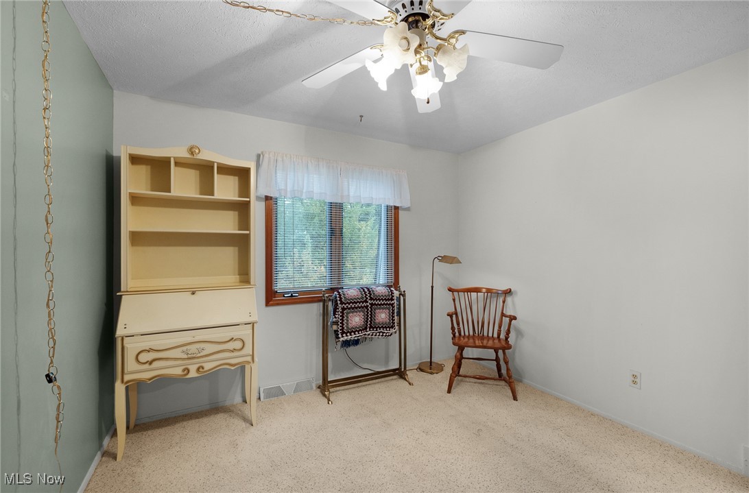 6474 State Road, Unit I10 Parma, OH 44134 - Photo 22 of 31 Sitting room featuring light carpet and a textured ceiling