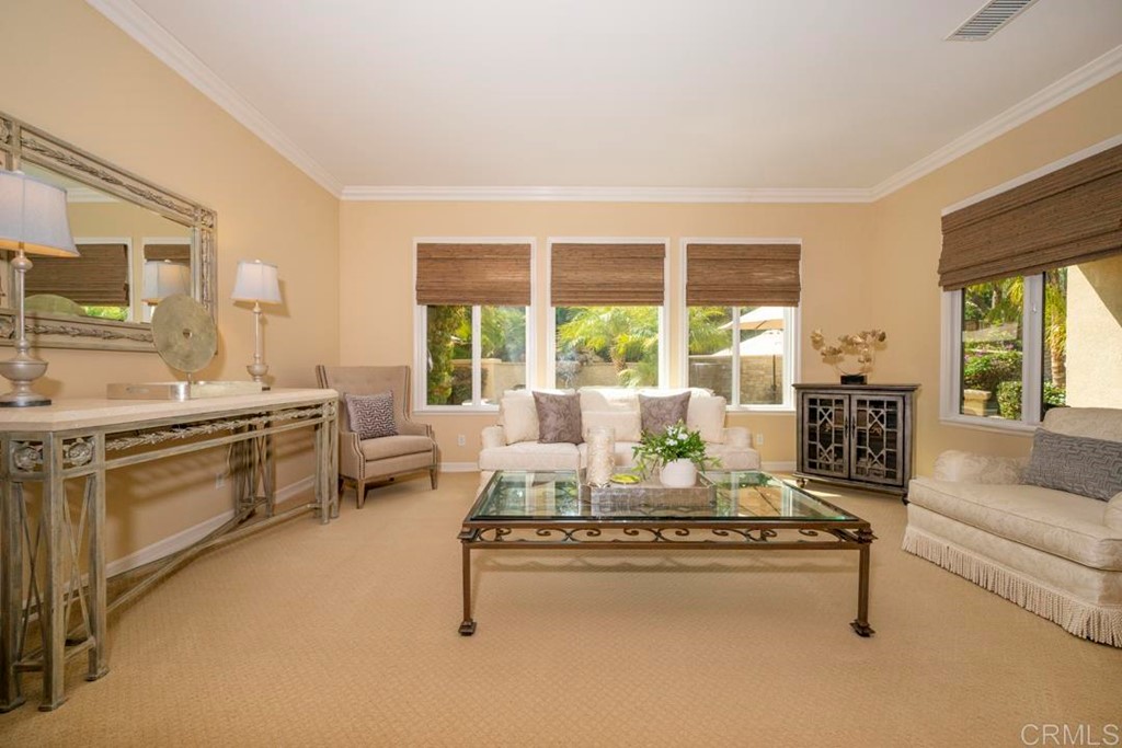 2887 Rancho Cortes Carlsbad, CA 92009 - Photo 17 of 46 a living room with furniture and floor to ceiling windows