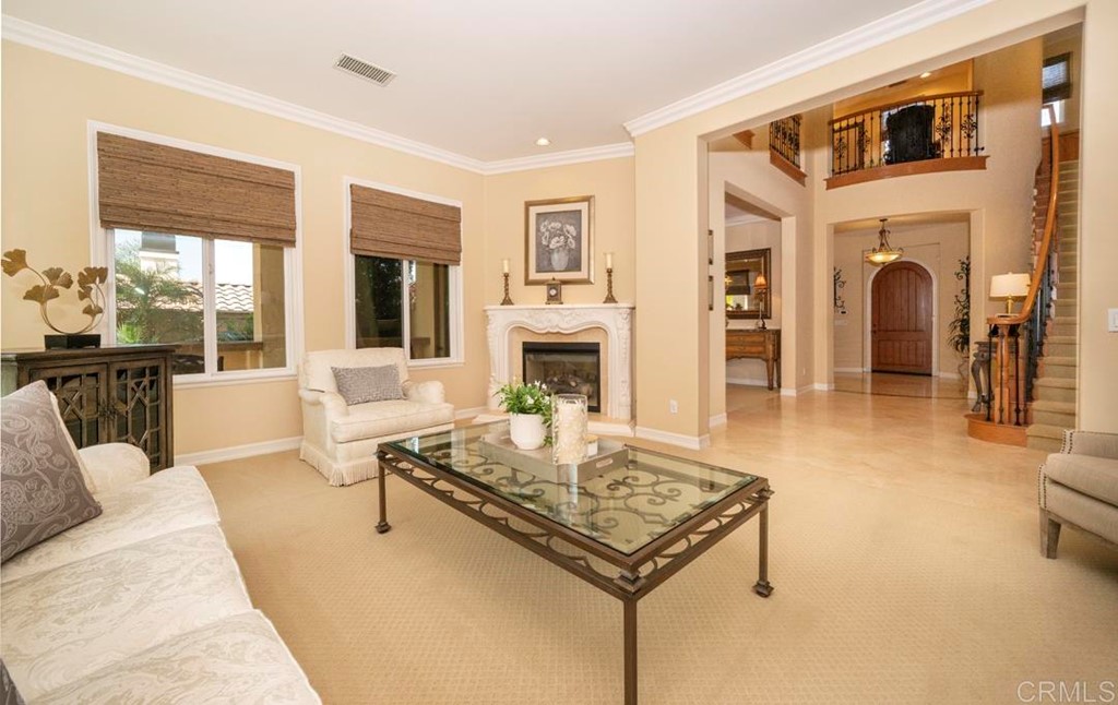 2887 Rancho Cortes Carlsbad, CA 92009 - Photo 18 of 46 a living room with fireplace furniture and a fireplace