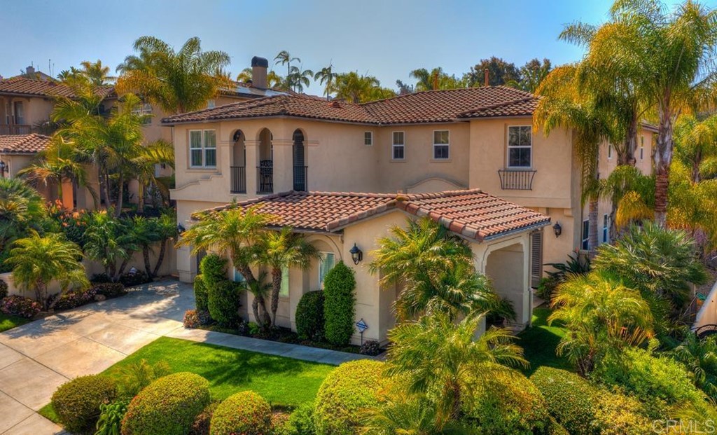2887 Rancho Cortes Carlsbad, CA 92009 - Photo 2 of 46 a view of a house with a yard and potted plants