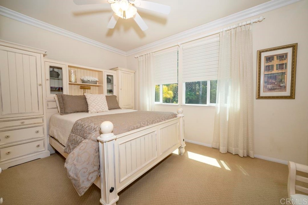 2887 Rancho Cortes Carlsbad, CA 92009 - Photo 36 of 46 a spacious bedroom with a large bed and a window