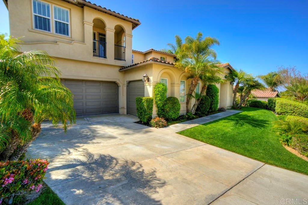 2887 Rancho Cortes Carlsbad, CA 92009 - Photo 40 of 46 a front view of a house with a yard