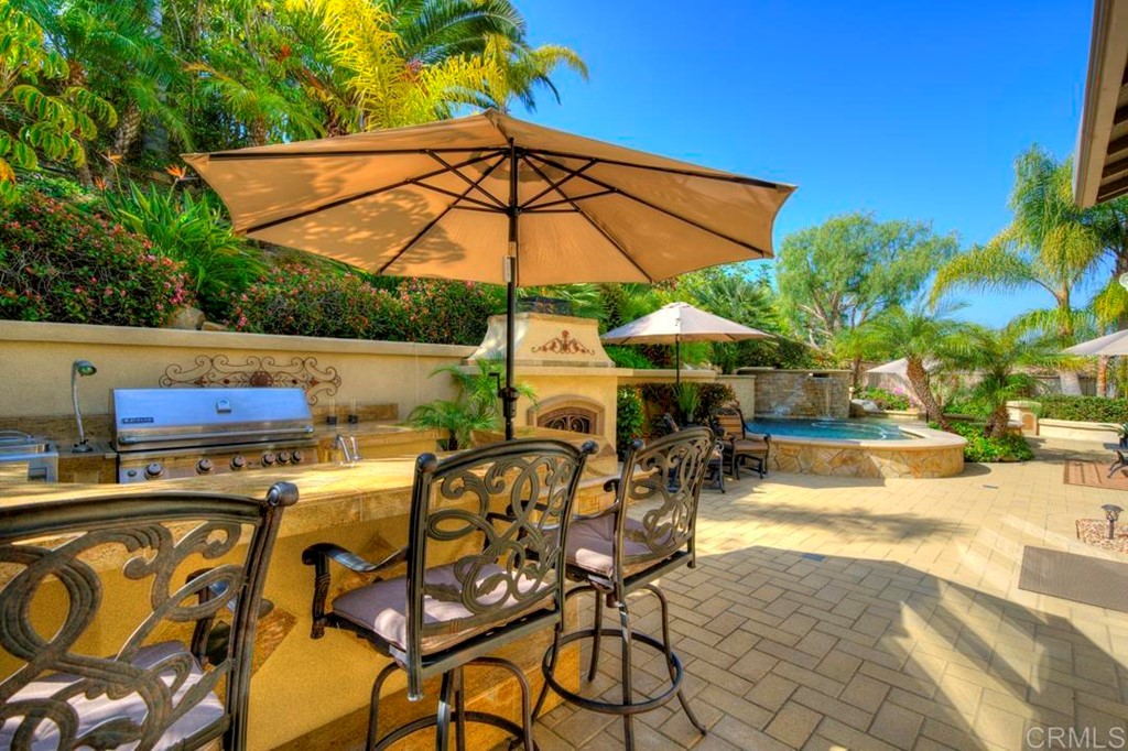 2887 Rancho Cortes Carlsbad, CA 92009 - Photo 5 of 46 a view of an outdoor sitting area with swimming pool