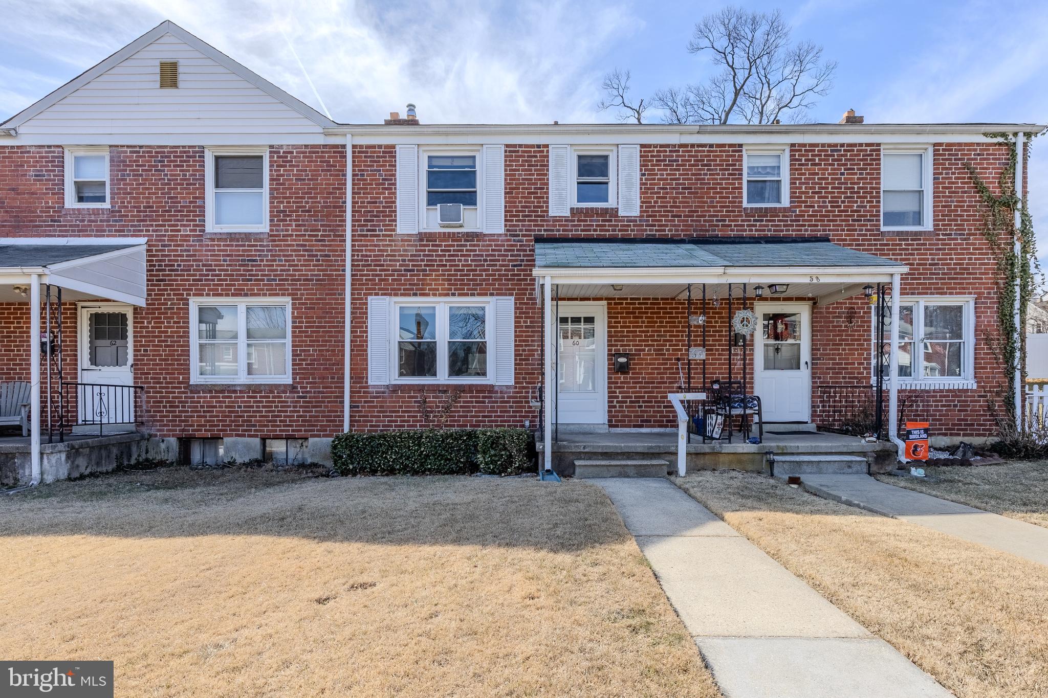 60 Garden Ridge Road Baltimore, MD 21228 - Photo 1 of 39 a view of a brick building with many windows