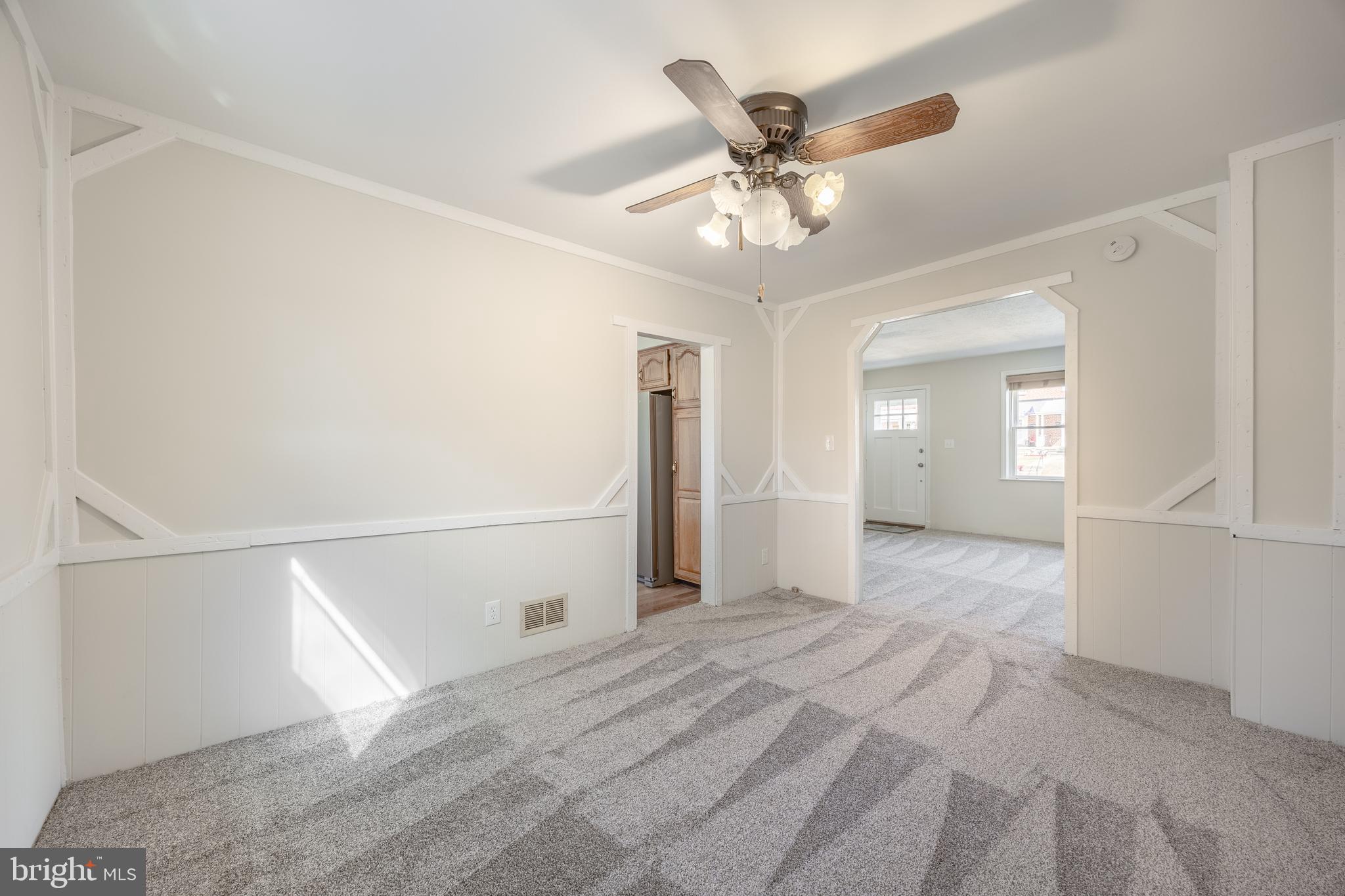 60 Garden Ridge Road Baltimore, MD 21228 - Photo 11 of 39 a view of a livingroom with a ceiling fan and window