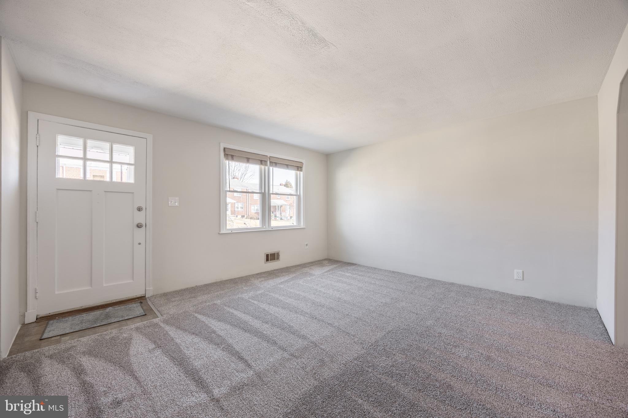 60 Garden Ridge Road Baltimore, MD 21228 - Photo 8 of 39 an empty room with windows