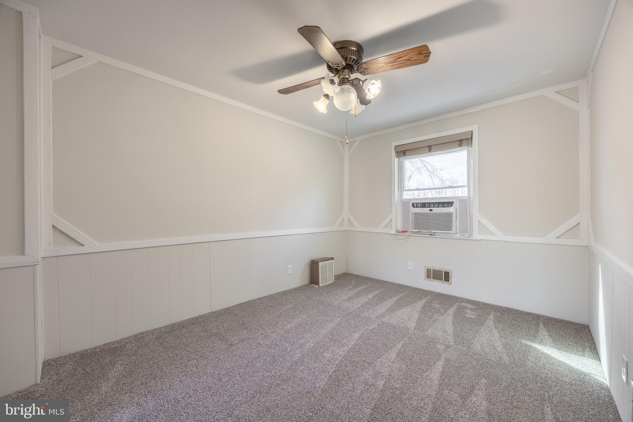 60 Garden Ridge Road Baltimore, MD 21228 - Photo 10 of 39 an empty room with windows and fan